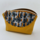 Trousse ocre jaune